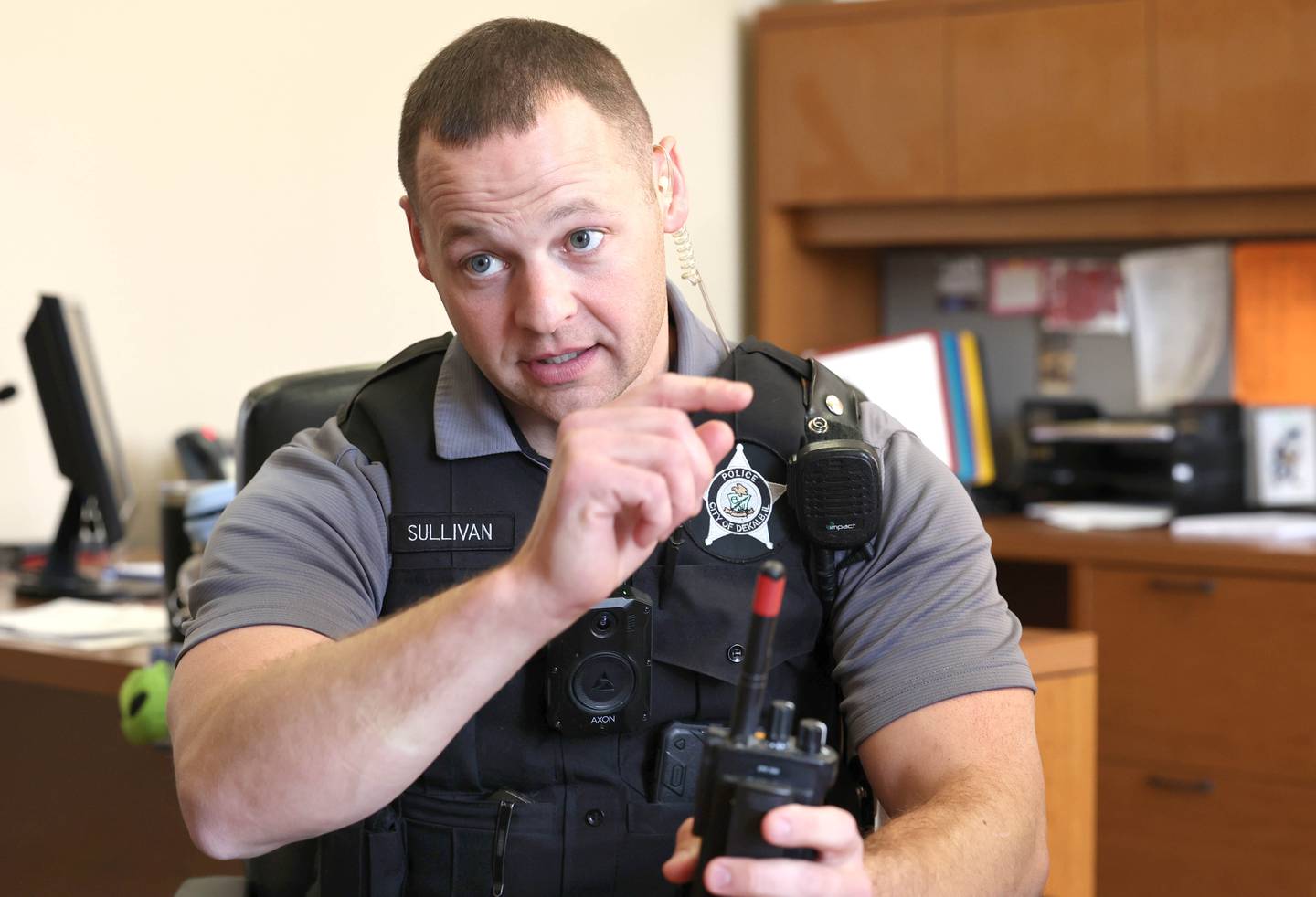 Chris Sullivan, DeKalb Police officer and student resource officer at DeKalb High School, talks Thursday, Oct. 20, 2022, at the school, about what he enjoys most about working with students and some of the challenges that it can create.
