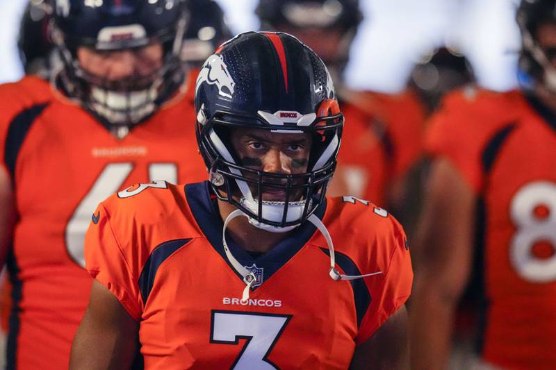 Denver Broncos quarterback Russell Wilson takes the field against the Minnesota Vikings during an NFL preseason football game, Saturday, Aug. 27, 2022, in Denver. (AP Photo/Jack Dempsey)