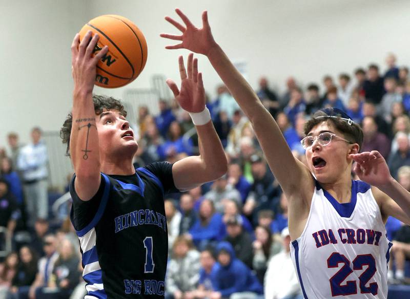 Hinckley-Big Rock's Sawyer Smith goes to the basket against Ida Crown’s Solomon Robinson during their Class 1A sectional game Wednesday, March 5, 2025, at Somonauk High School.