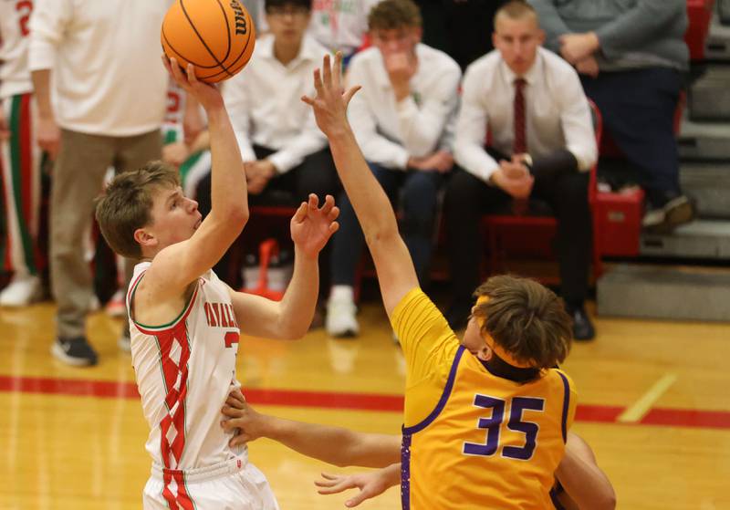 L-P's Braylin Bond shoots a jump shot over Rantoul's Eli Reichenbach on Friday, Dec. 19, 2025 in Sellett Gymnasium at L-P High School.