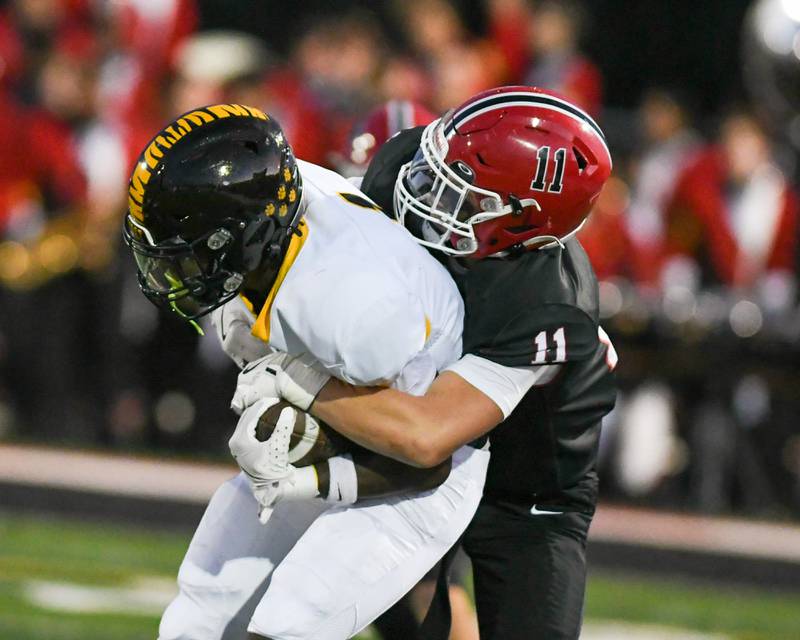 Yorkville's Caleb Viscogliosi (11) tackles Joliet West's ball carrier Jordan Bennett (1) during the game on Friday Sept. 5, 2025, held at Yorkville High School.