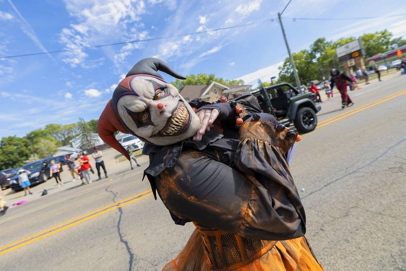 Spooky season is right around the corner. A character from Haunted Haven smiles for the picture Saturday, Sept. 14, 2024, while marching through the Fiesta Days parade.