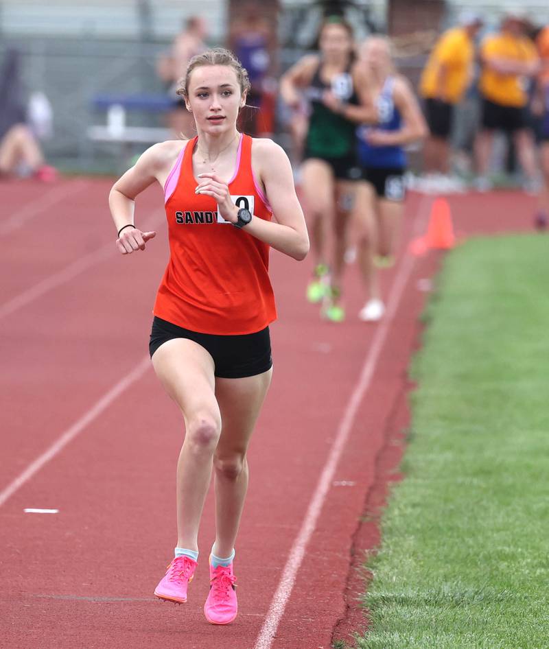 Sandwich’s Sundara Weber comfortably leads as she runs the 3200 meters Wednesday, May 8, 2024, during the girls track Class 2A sectional at Rochelle High School.