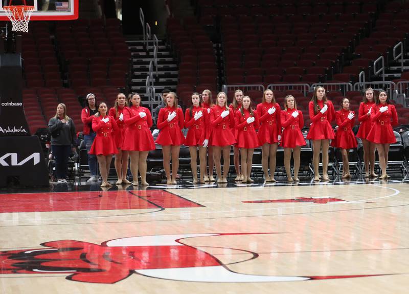 Members of the Streatorettes stand for the National Anthem during a game on Tuesday, Dec. 21, 2023 at the United Center in Chicago.