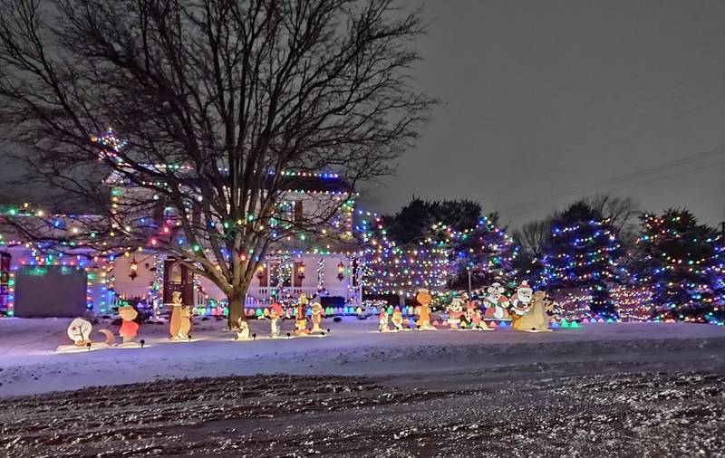 A Christmas display featuring several characters is set up at a home on Shabbona Street in Streator, near Fourth Street.