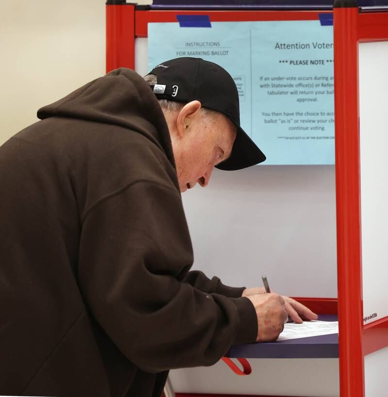 Richard Finnestad, from DeKalb, casts his ballot Tuesday, Nov. 5, 2024, Election Day, at the DeKalb Public Library.