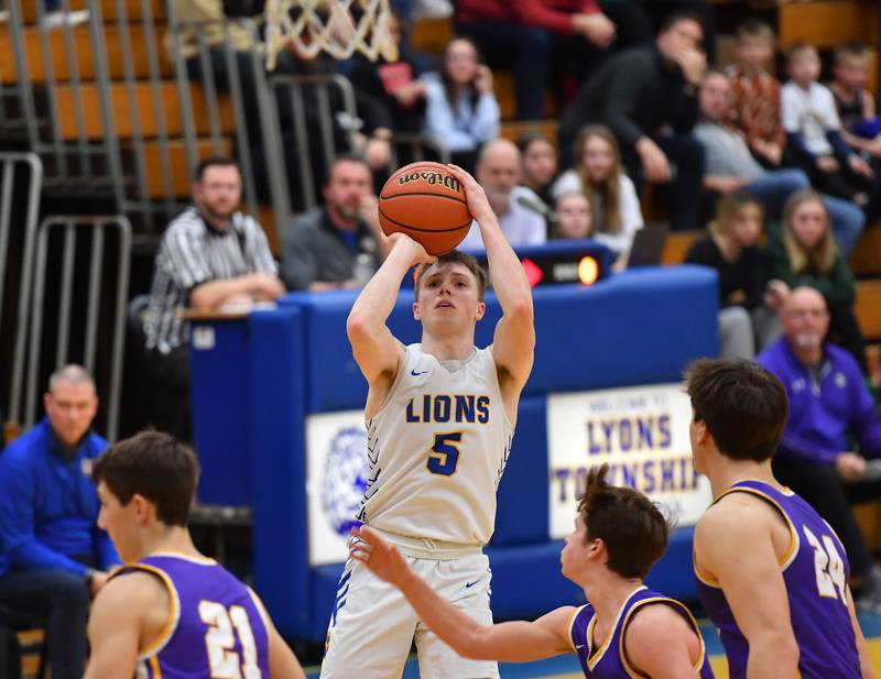 Lyons Township's Jackson Niego (5) shoots the winning basket with 11 seconds left in the game against Downers Grove North on Jan. 6, 2023 at Lyons Township High School in LaGrange.