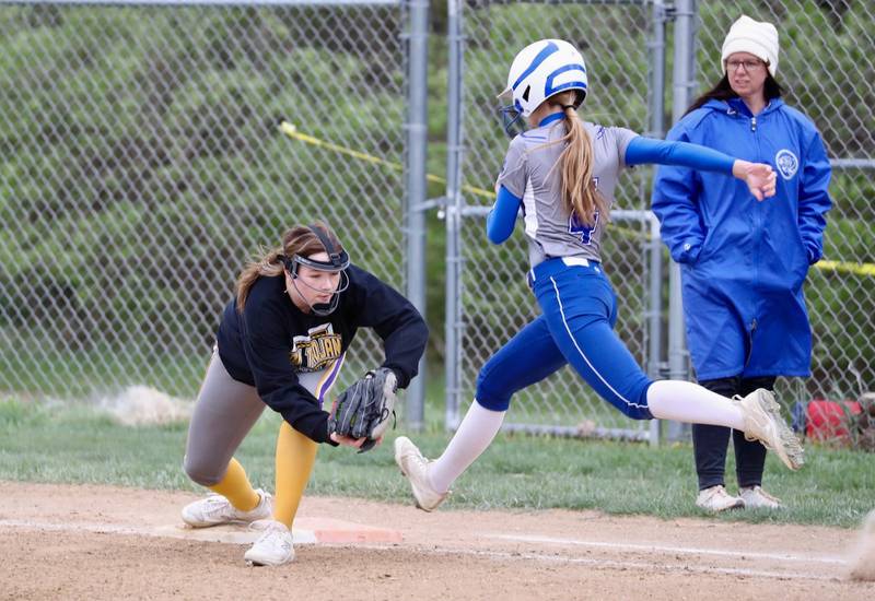 Mendota first baseman Kirby Bond takes the throw for the out on Princeton's Caroline Keutzer Tuesday.