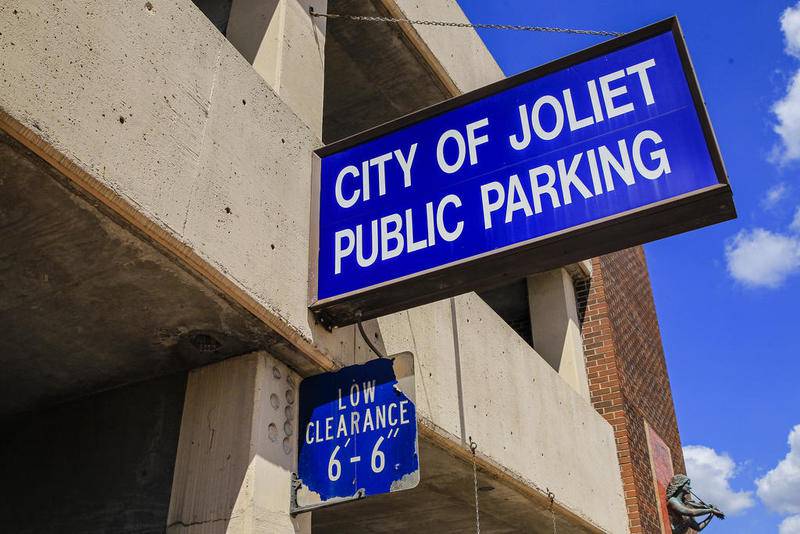 A sign marks the entrance to the Scott Street parking deck on Wednesday in Joliet. Mayor Bob O'Dekirk again is pushing the idea of free parking downtown.