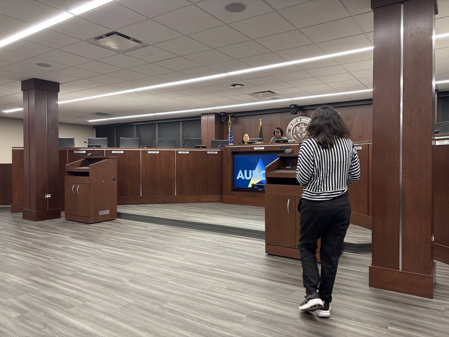 Edith Calderon approaches the podium during an immigration forum hosted by U.S. Rep. Lauren Underwood in Aurora Oct. 10, 2025.