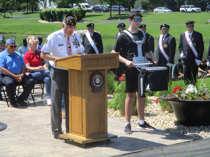 Greg Roach, past commander of American Legion Marne Post 13 in Plainfield, reads the names of soldiers who died during the current "Epic Fury" military engagement in the Middle East during a Memorial Day service in Plainfield on Monday. May 25, 2026