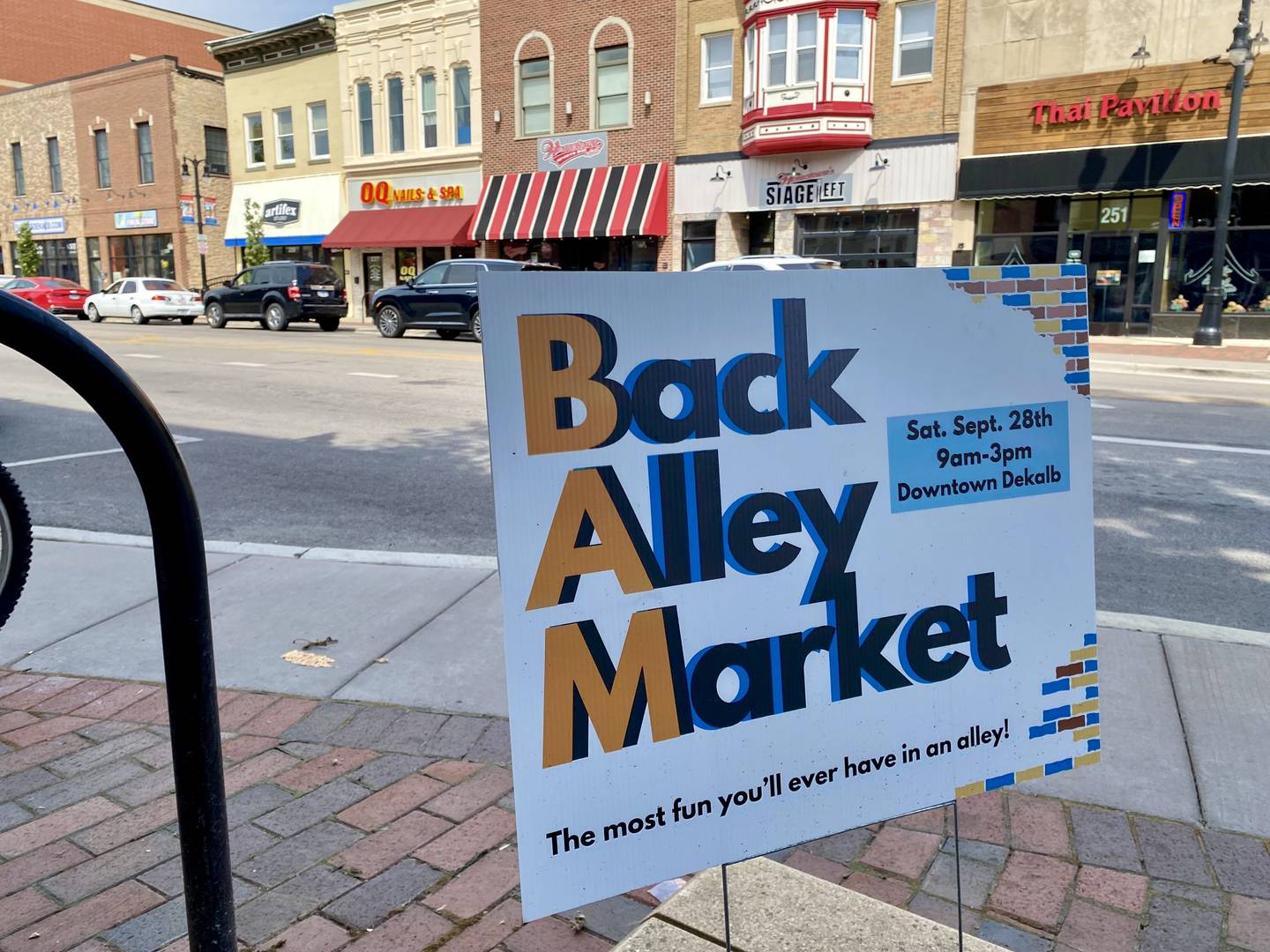 A sign stands in downtown DeKalb along Lincoln Highway. DeKalb's seasonal Back Alley Market runs 9 a.m. to 3 p.m. Sept. 28, 2024, in Palmer Court downtown. The family-friendly vendor and craft event is hosted by various downtown merchants and is expected to feature more than 100 booths from across the region.