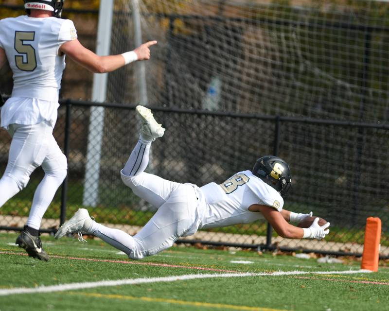 Sycamore’s Diego Garcia (8) dives towards the end zone during the second quarter where he was ruled down on the one yard line while taking on Morgan park on Saturday Nov. 4, 2023 at Gately Stadium in Chicago.