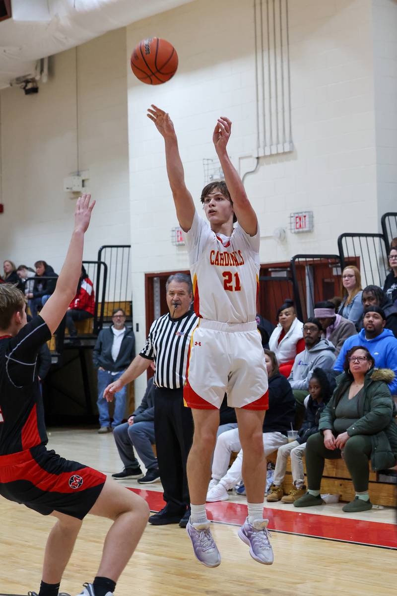 St. Anne's Trevor Van Pelt shoots a 3-pointer over Momence's Greyson Cantwell during St. Anne's 64-43 victory in the River Valley Conference semifinals on Tuesday, Feb. 10, 2026.