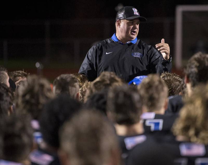 Lincoln-Way East Head Coach Rob Zvonar speaks with his team after winning the 2nd round playoff game against Waubonsie Valley on Saturday, Nov. 5, 2016 at Lincoln-Way East High School.