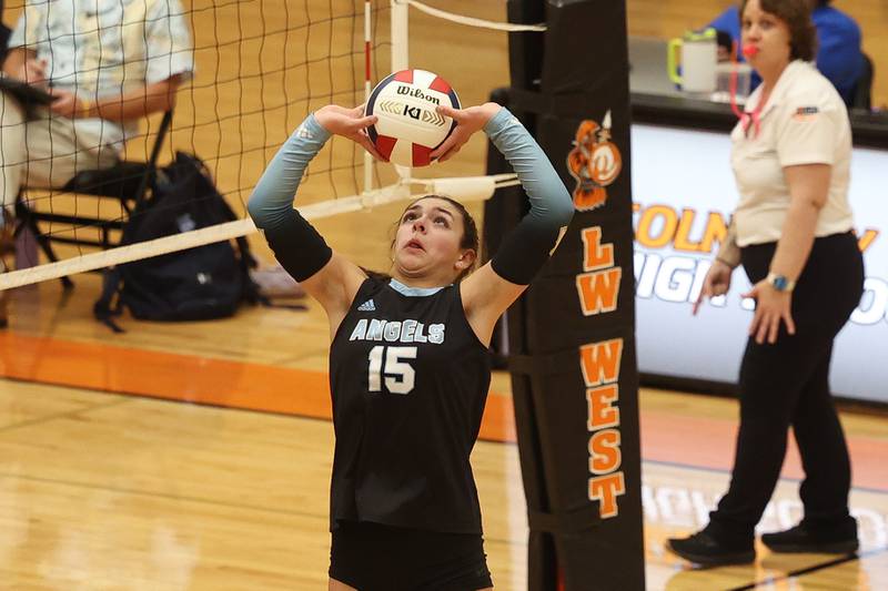 Joliet Catholic’s Maggie Tibbott sets the ball against Plainfield South in the Class 4A Lincoln-Way West Regional semifinal on Tuesday, Oct. 29, 2024 in New Lenox.