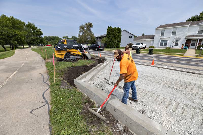 Employees with Stitcher Construction of Erie work on the new parking area at Thomas Park in Sterling on Thursday, Aug. 7, 2025. The new lot will help alleviate local congestion for the popular pickleball courts.