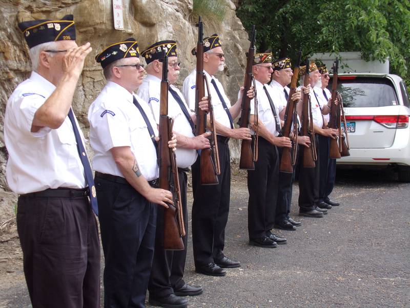 The Marseilles Honor Guard gives a salute Monday, May 29, 2023, during a Memorial Dedication Ceremony.