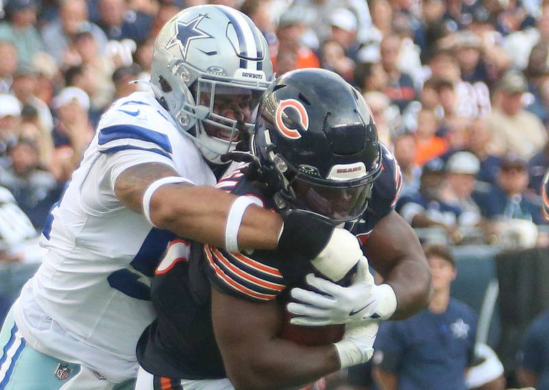 Chicago Bears running back Kyle Monangia runs with the ball as Dallas Cowboys defensive end Marshawn Kneeland takes him down on Sunday, Sept. 21, 2025 at Soldier Field.