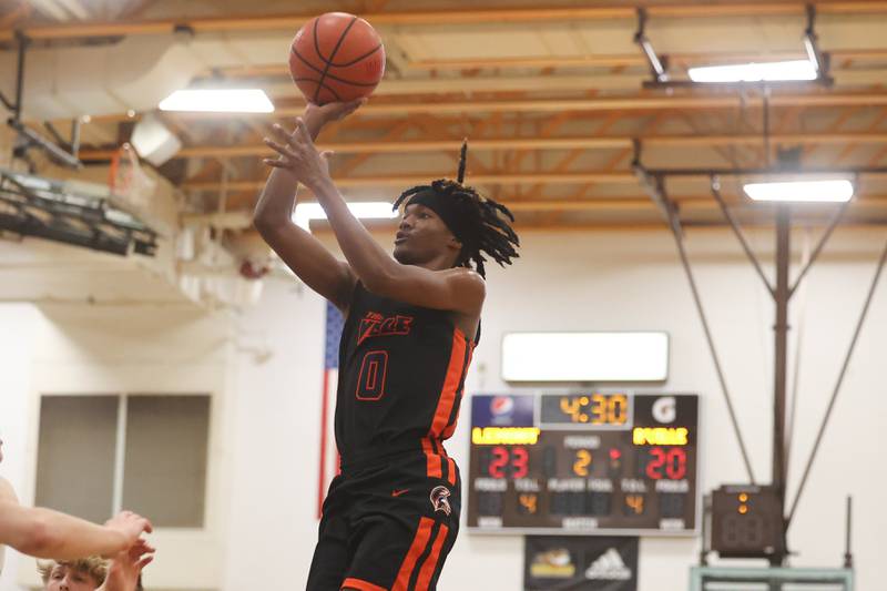 Romeoville’s Adam Walker puts up a shot against Lemont in the WJOL Thanksgiving Classic Championship in Joliet on Saturday.
