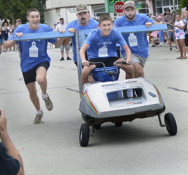 The Sheridan Elevator team speeds down Si Johnson Ave during the annual Toilet Bowl Races as part of the towns 4th of July celebration.
