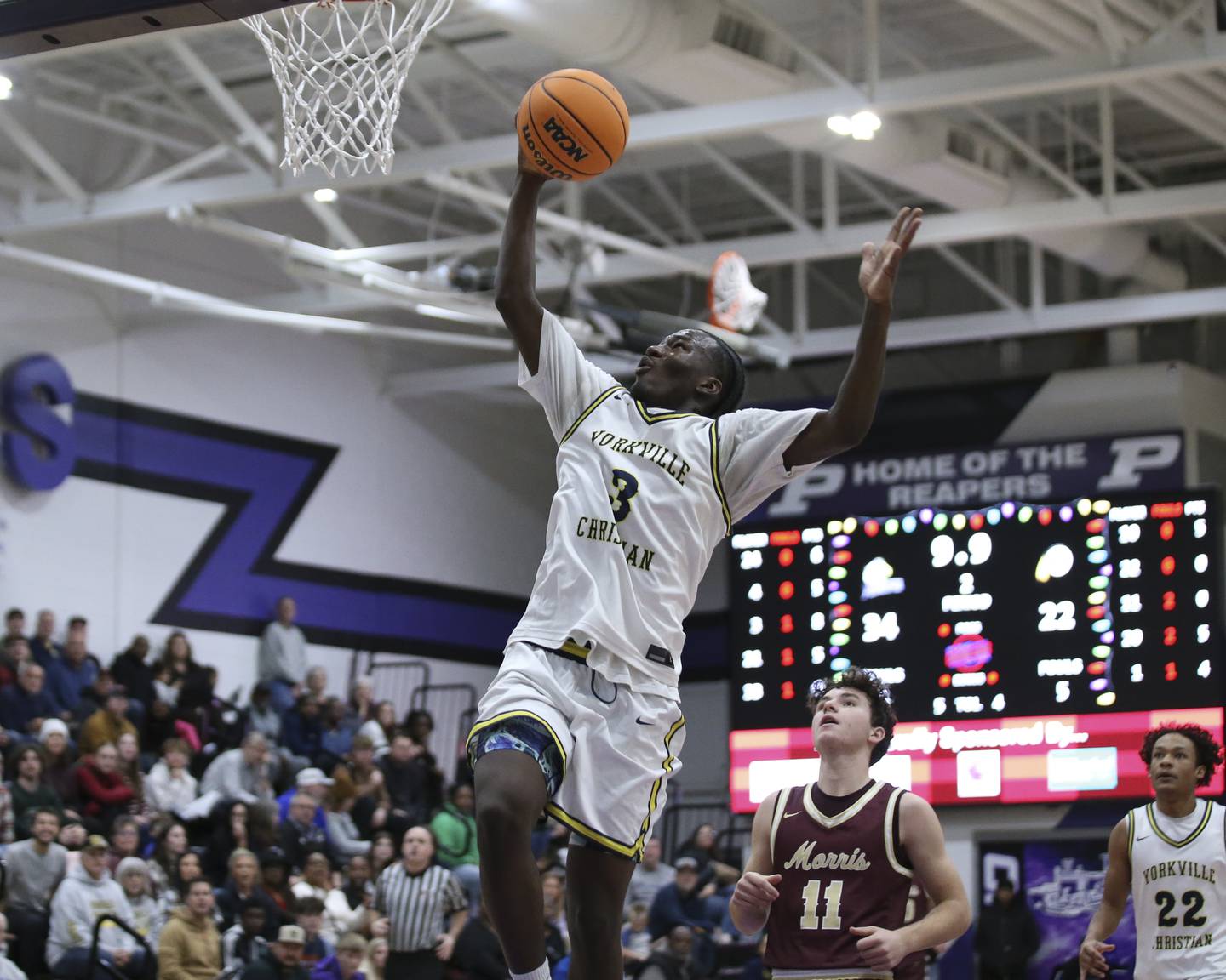 Yorkville Christian's Jayden Riley (3) puts in a lay up during their Plano Christmas Classic basketball game between Morris at Yorkville Christian Friday, Dec 26, 2025 in Plano.