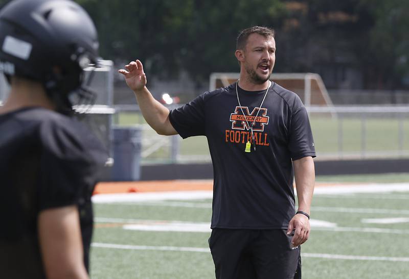 McHenry Head Coach Colt Nero instructs his team during football practice on Thursday, July 24, 2025, at McCracken Field, in McHenry.
