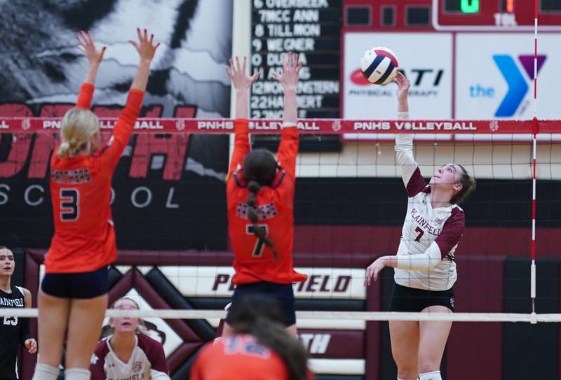Plainfield North's Riley Cunningham (right) goes up for a kill against Oswego during the class 4A Plainfield North regional volleyball final at Plainfield North High School on Thursday, Oct. 26, 2023.