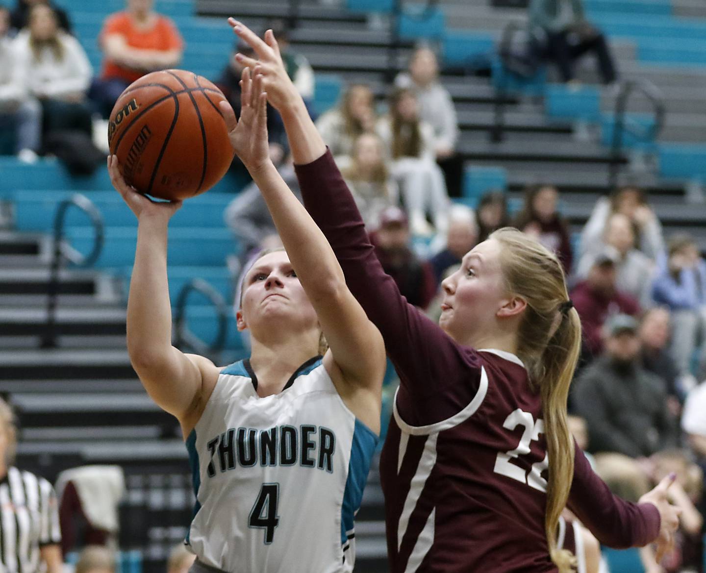 Woodstock North’s Caylin Stevens drives to the basket against Marengo's Dayna Carr as Carr tries to block the shot during a Kishwaukee River Conference girls basketball game Monday, Jan. 29, 2024, at Woodstock North High School.