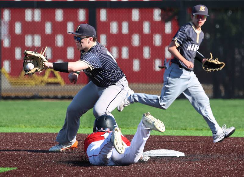 Hiawatha's Kamden Rasmus fields the throw as South Beloit's Zane Hagstrom steals second Thursday, April 16, 2026, during their game at Northern Illinois University in DeKalb.