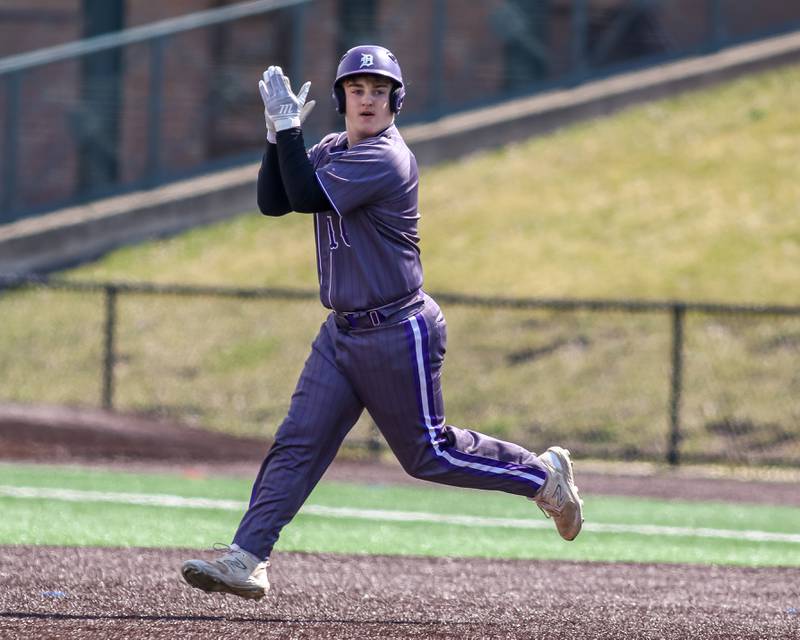 Dixon's Brady Lawrence (16) rounds the bases after hitting a homerun during baseball game between Dixon at Hampshire.  March 28, 2024