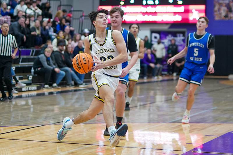 Yorkville Christian's Zach Marini (23) drives to the basket during a basketball game in the opening round of the 61st annual Plano Christmas Classic against Hinckley-Big Rock at Plano High School on Monday, December 23, 2024.