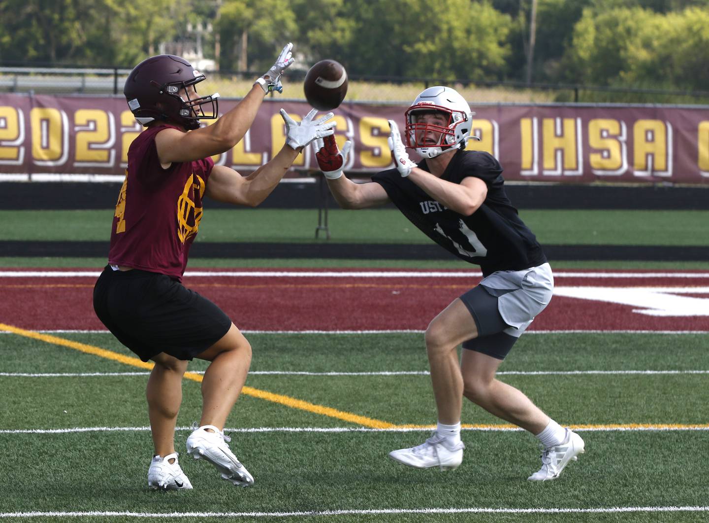 Richmond-Burton’s Hunter Carley tries to catch a pass during a 7 on 7 football practice Monday, July 14, 2025, at Richmond-Burton High School, with teams from Crystal Lake Central, Grayslake Central and Mundelein.