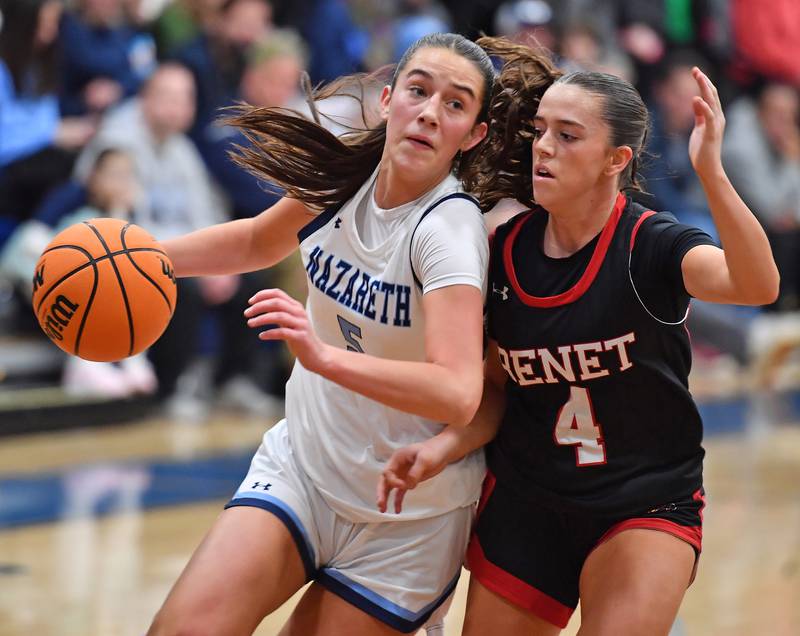 Nazareth’s Sophia Towne drives as Benet’s Ava Mersinger (4) defends during a game on December 13, 2025 at Nazareth Academy in LaGrange Park.