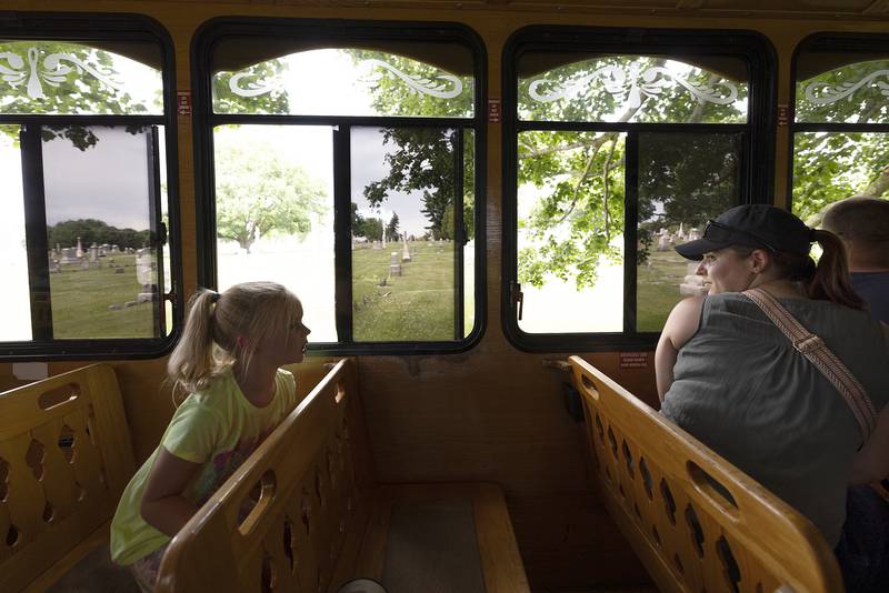 Visitors ride through Fairmount Cemetery on a trolley Saturday, June 28, 2025, during a historical tour of Polo’s part in the Underground Railroad.