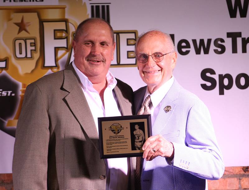 Don Hamel receives his award from Lanny Slevin Emcee, during the Shaw Media Illinois Valley Sports Hall of Fame on Thursday, June 8, 2023 at the Auditorium Ballroom in La Salle. Hamel, is the all-time leading scorer Mendota High School history with 2,158 points.