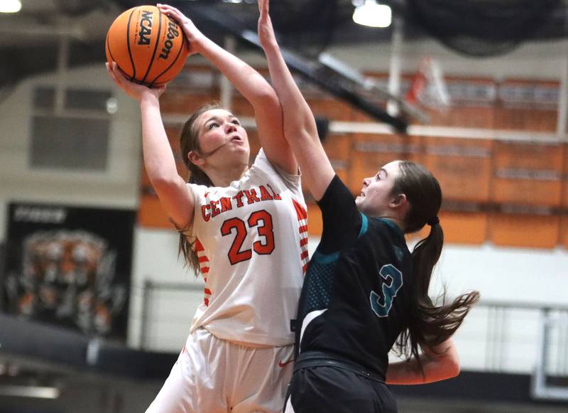 Crystal Lake Central’s Jordyn Johnson shoots as Woodstock North’s Adelyn Crabill in varsity girls basketball on Monday, Jan. 26, 2026, at Crystal Lake Central High School in Crystal Lake.