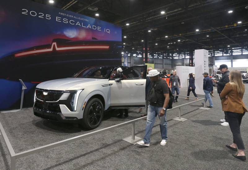 Visitors check out the first-ever all-electric 2025 Cadillac Escalade IQ on Thursday, Feb. 8, 2024 during the Chicago Auto Show in McCormick Place.