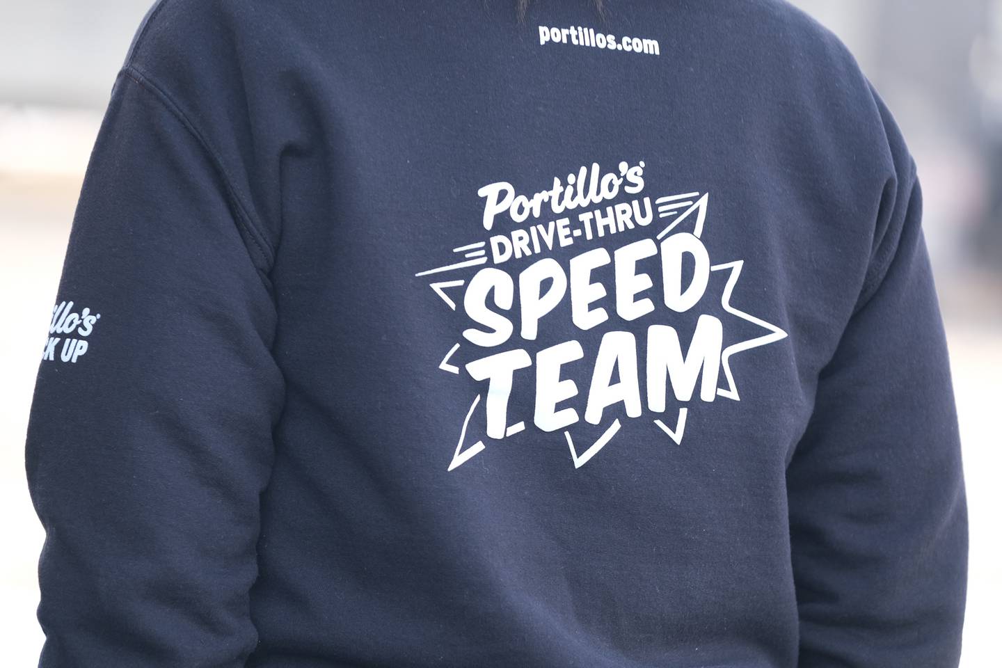 Known for their fast delivery, Portillo’s staff wear shirts resembling race car pit crews at the opening of the new Joliet Portillo’s location on North Larkin. Tuesday, Feb. 1, 2022 in Joliet.