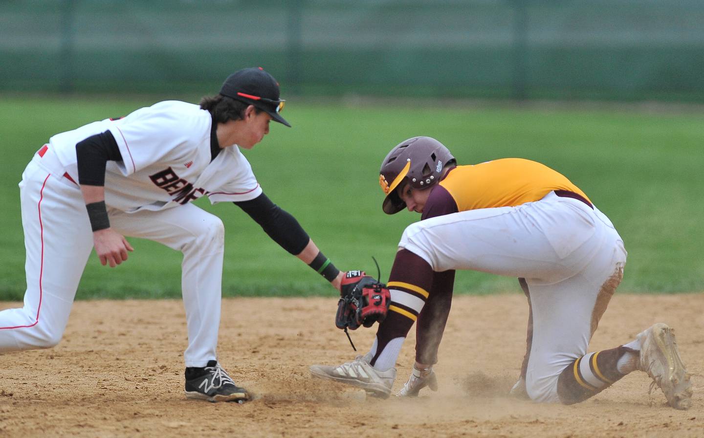 Montini's Michael Wind (right) arrives safely at second base with a double as Benet's Marc Iozzo makes a late tag  during a game on Apr. 28, 2022 at Benet Academy in Lisle.