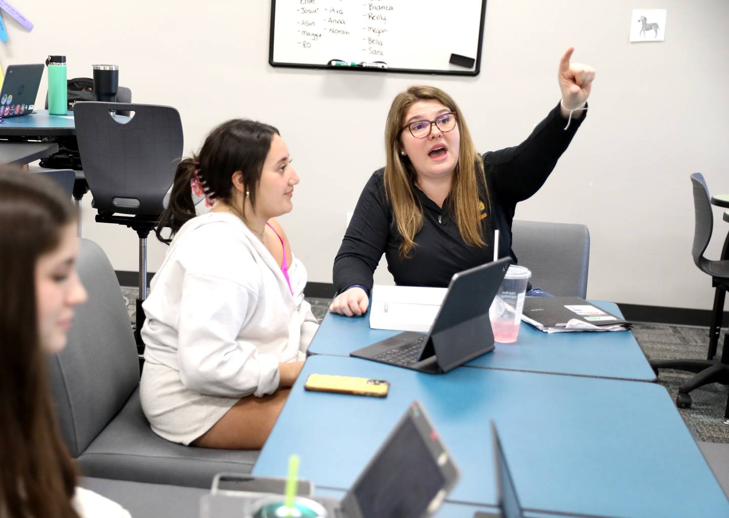 Batavia High School Early Childhood Instructor Austen Savitski (right) works with junior and aspriring teacher Chloe Ford.