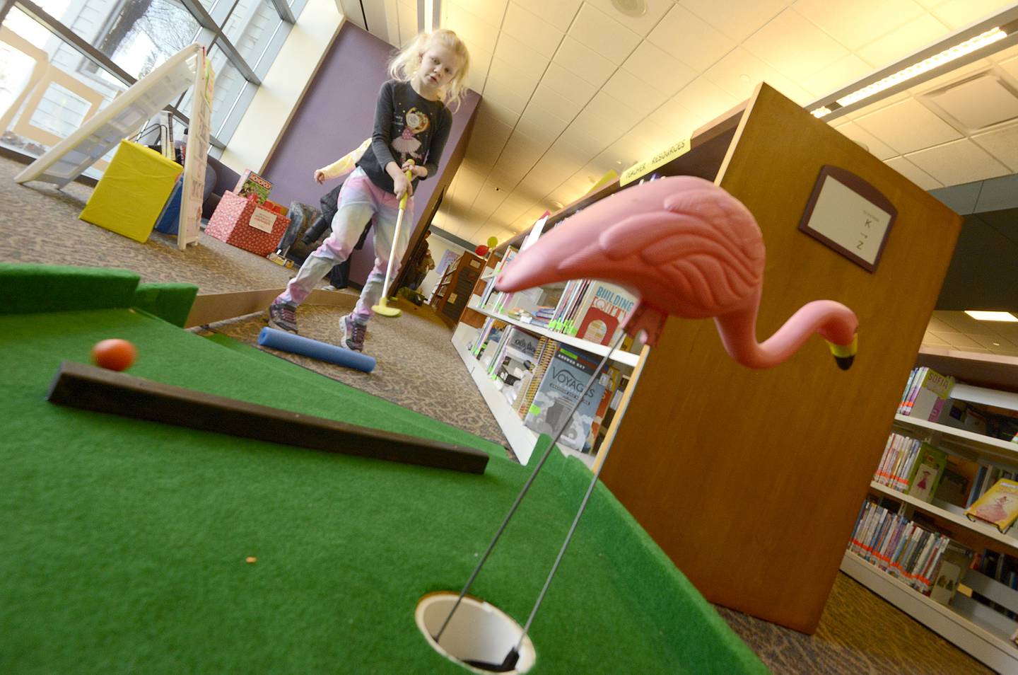 Mini golfers of all ages enjoy the game indoors at Yorkville Library’s annual FunRaiser event