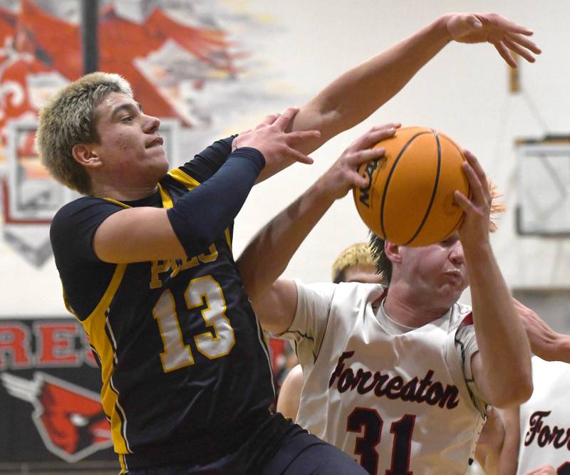 Polo's Eli Perez (13) and Forreston's Brennan Byers (31) battle for the ball on Saturday, Dec. 13, 2025 at the 64th Annual Forreston Holiday Basketball Tournament held at Forreston High School.