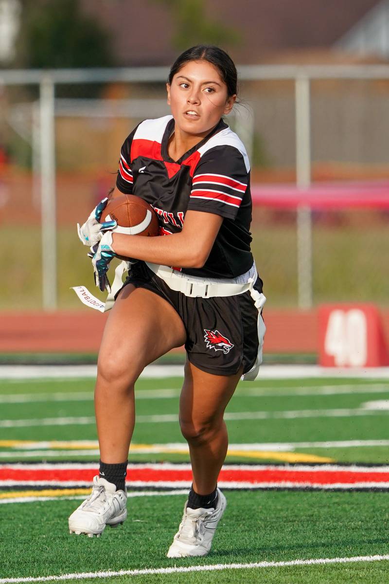 Yorkville's Teaghan Green (8) runs after the catch against Joliet Central during a flag football game at Yorkville High School on Monday, Sep 23, 2024.