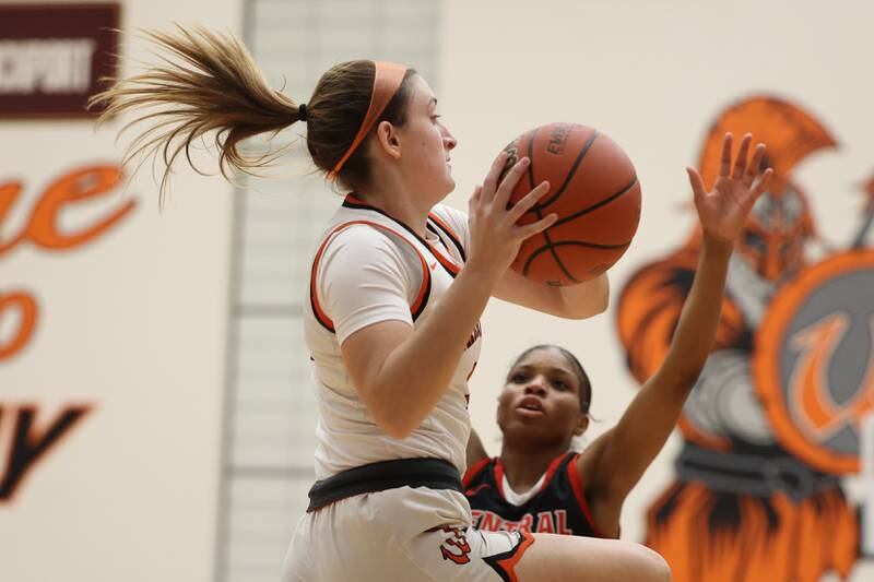 Lincoln-Way West’s Raylin Caballero passes out of the paint against Lincoln-Way Central on Tuesday, February 7th.