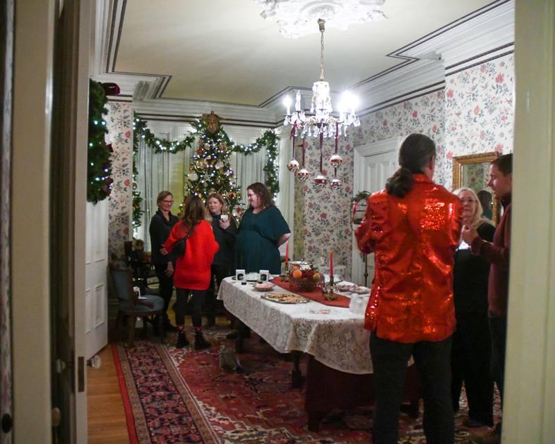 Community members gather at The Samuel Vial House that was one of four homes during the Holiday Sip and Sweet Tour event held in La Grange on Sunday Dec. 17, 2023.