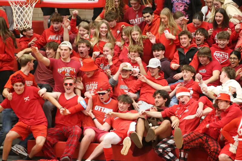 Ottawa superfans react after Owen Sanders dunks the ball against L-P on Friday, Jan. 10, 2024 in Kingman Gym at Ottawa High School.