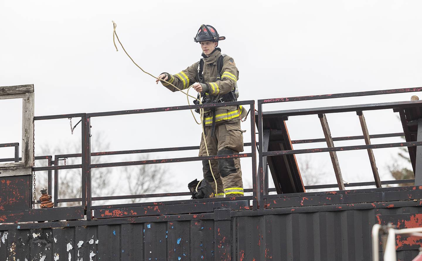 Ezra Parker, 17, of Amboy throws a rope down Saturday, March 15, 2025, during training.