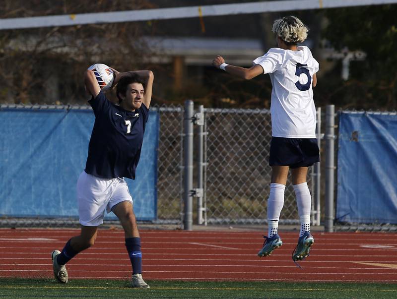 Belleville Althoff Catholic's Tyler Pollock throws the ball in over a jumping Lemont's Giovanni Ochoa during an IHSA Class 3A state semifinal soccer match on Friday, Nov. 8, 2024, at Hoffman Estates High School.