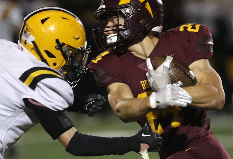 Richmond-Burton's Hunter Carley tries to get away from St. Laurence's Mickey Lotus during an IHSA Class 4A first-round football game on Friday, Nov. 1, 2024, at Richmond-Burton High School in Richmond.